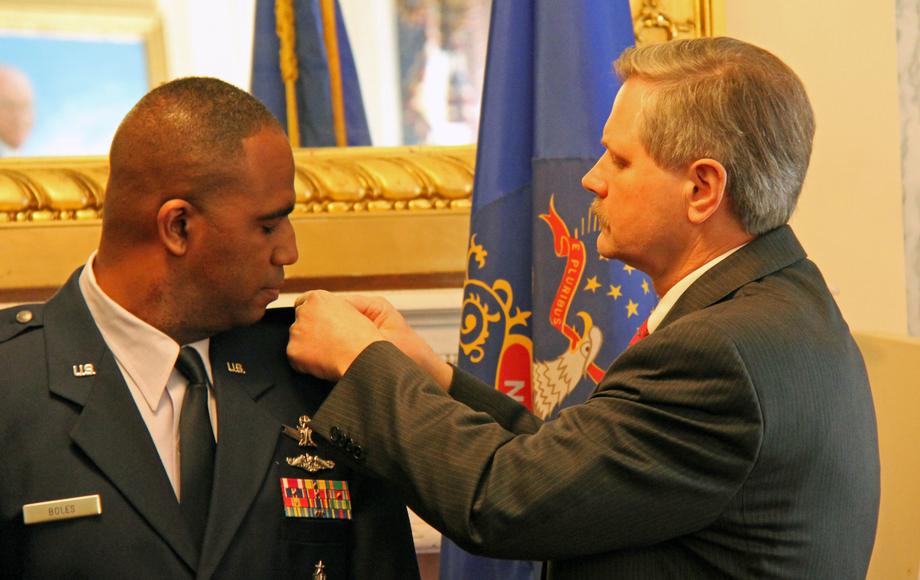 Hoeven at Air Force Promotion Ceremony-May 2011-Senator John Hoeven pins a new rank on U.S. Air Force Senate Liaison Lt. Col. Sean Boles. Hoeven presided over the ceremony promoting Boles from Major to Lieutenant Colonel. Boles is the principal Air Force liaison with the Senate Armed Services, Budget and Appropriations Committees. 